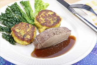 Swabian cuisine, medallions of wild boar with savoy cabbage cakes, meat dish, roasted, hearty, home