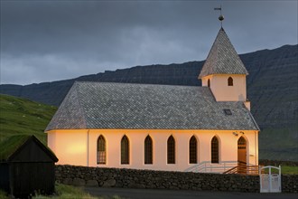 Illuminated church of Vidareidi, Vidoy Island, Viðareiði, Viðoy Island, Faroe Islands, Denmark,