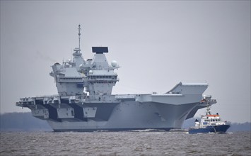 Aircraft carrier HMS Queen Elizabeth on the Elbe between Hamburg and the North Sea,