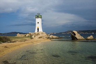 Lighthouse with beach and bizarre granite rocks, Spiaggia Porto Faro, Faro di Punta Palau, Palau,