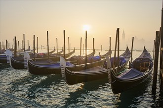 View from 'Colonna di San Marco e San Teodoro' on the gondolas lying in the water with the church