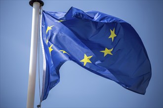 Flag of the European Union in front of a blue sky