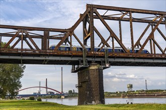 The railway bridge Duisburg-Hochfeld-Rheinhausen, over the Rhine, regional trains and many goods