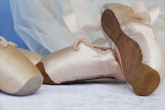 Ballet shoes, pointe shoes, dance shoes covered with satin in light pink colour, leather sole,