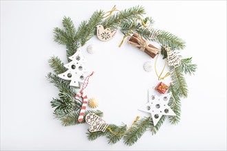 Christmas or New Year wreath composition. Decorations, stars, bells, fir and spruce branches, on