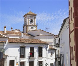 Whitewashed houses cluster around church tower, village of Grazalema, Cadiz province, Spain, Europe