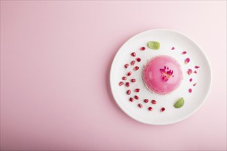 Pink mousse cake with strawberry on a pastel pink background. top view, flat lay, copy space