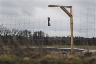 A gallows with a symbolic traffic light stands in a field near Gablenz, 14 Jan. 2024. As part of