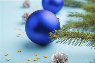 Christmas or New Year composition. Decorations, blue balls, cones, fir and spruce branches, on a