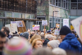 Crowd of people holding up signs at a political demonstration, demonstration against the right,