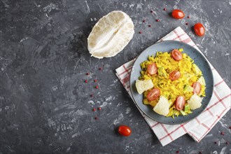 Fried pomelo with tomatoes and avocado on black concrete background. Top view, copy space, myanmar