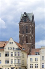 Historic houses, at the back the remaining tower of St Mary's Church, Wismar,