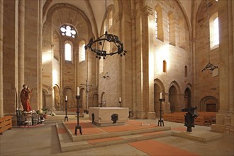 Interior view with chancel of the Romanesque abbey church, altar, candlestick, figure, saint,