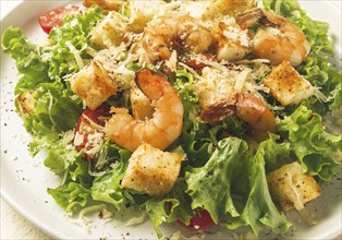 Caesar salad, with shrimp, on a white background, homemade, no people