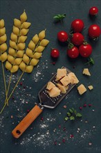 Food concept, pasta, with cherry and parmesan cheese, top view, no people, wheat, pasta spikelets