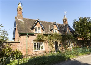 Attractive detached red brick historic house in village of Compton Bassett, Wiltshire, England, UK