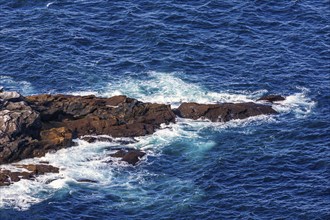 Sea waves crashing on a rocky shore