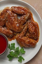 Chicken wings, with barbecue sauce, with tomato sauce, fast food, no people