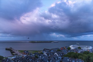 View from the upper land over the houses in the lower land to the Helgoland dune, Helgoland island,