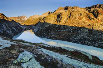 Sunrise in the Swiss Alps with Grimselsee and Lauteraarhorn in the canton of Bern, Switzerland,