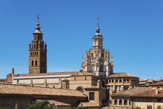 Historic church with several towers and brick facade in front of a clear blue sky, Cathedral,