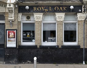 Royal Oak pub with damaged sign, Kirkley, Lowestoft, Suffolk, England, UK