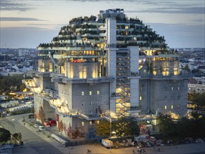 Aerial view of the Hamburg Bunker with green terraces and modern architecture in the evening