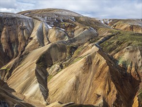 Early snow on the colorful rhyolite mountains, Landmannalaugar, Fjallabak Nature Reserve, Iceland,