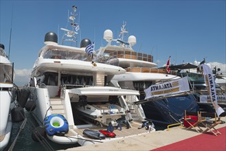 Yachts in the harbour with maritime equipment, sunny weather and blue sky, Mediterranean yacht