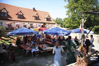 Beer garden at Königsberg Castle, a medieval imperial castle overlooking the town of Koenigsberg in