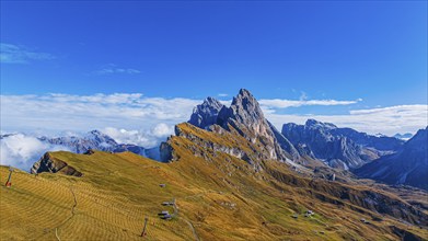 The Sas Rigais and Furchetta peaks of the Odle Group, drone shot, Val Gardena, Dolomites,