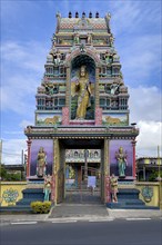 Portal tower with statues of deities Statues of deities at the entrance to Hindu temple Shri Sri