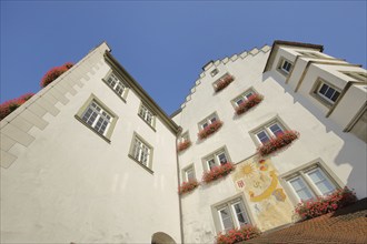 Historic gate castle with stepped gable, oriel and wall painting, wall painting, view upwards, town