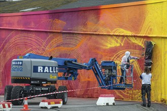 American street artist Douglas Hoekzema, also known as HOXXOH paints a wall in Ystad, Skåne County,