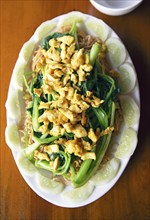 Mi Xao Ga or fried noodles with chicken, traditional dish in Vietnam