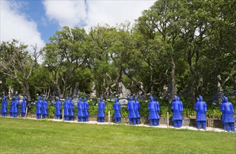 A row of blue terracotta soldier statues stands in a park-like setting, Bacalhôa, Bacalhoa Buddha