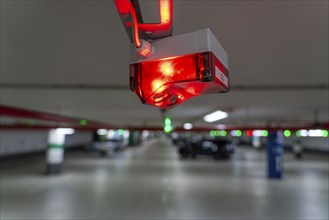 Underground car parks, multi-storey car parks, red or green lamps on the ceiling, show drivers