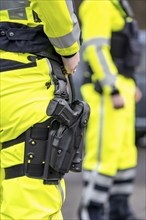 Police, policeman, weapon in thigh holster, uniform of the motorway police North Rhine-Westphalia