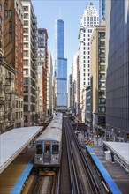 Chicago L Elevated elevated metro train public transport train at the Adams Wabash stop in Chicago,