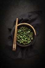 Fried bean pods, in soy sauce, with sesame seeds, homemade, no people