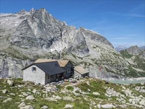 Capanna da l'Albigna, Albinga hut, above dam of reservoir Lake Albigna near village Vicosoprano,