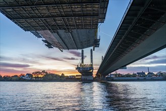 New construction of the motorway bridge Neuenkamp of the A40, over the Rhine near Duisburg, evening