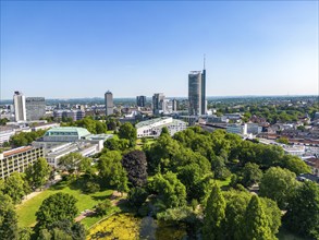 The skyline of Essen city centre, with the RWE Tower on the right and Stadtgarten Park in front,