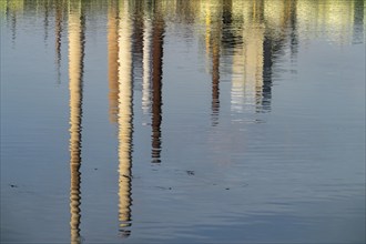 Reflections of the chimneys of the ThyssenKrupp Steel steelworks in Bruckhausen, in the Rhine,