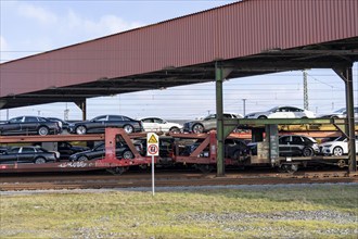 Car train, goods train on its way to the car terminal in Bremerhaven seaport, new German cars for