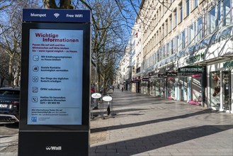 Advertising displays, on Königsallee, Kö, give advice on correct behaviour, empty city centre,