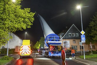 Transport of a 68 metre long, 22 tonne blade of a wind turbine, here in Breckerfeld-Waldbauer, with