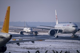 Aircraft on the taxiway at Frankfurt FRA airport, Fraport, in winter, Hesse, Germany, Europe