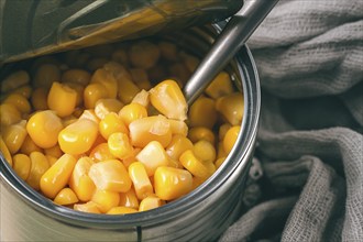 Open tin can, with corn, top view, selective focus, no people, close-up