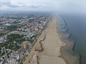 Bathing beach in Rimini. Bathing beach on the Adriatic in bad weather. All deckchairs are free.